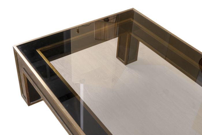 table basse noire et or dessus plateau verre