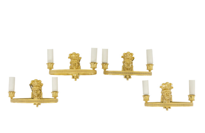 Series of four Empire style sconces in gilded bronze, representing Nubians - the set