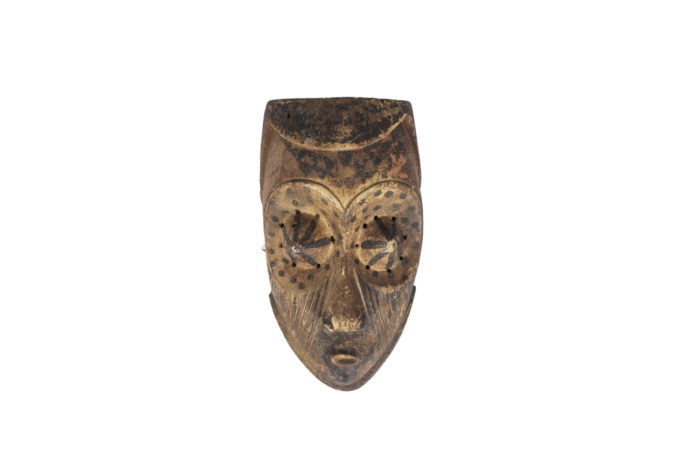 African mask "Kuba Babuka" in wood and pigments. 20th century.