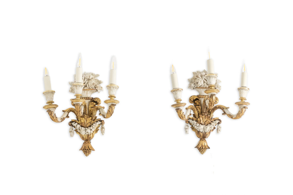 Pair of Louis XVI style wall lights in gilded and lacquered wood. Circa 1900.