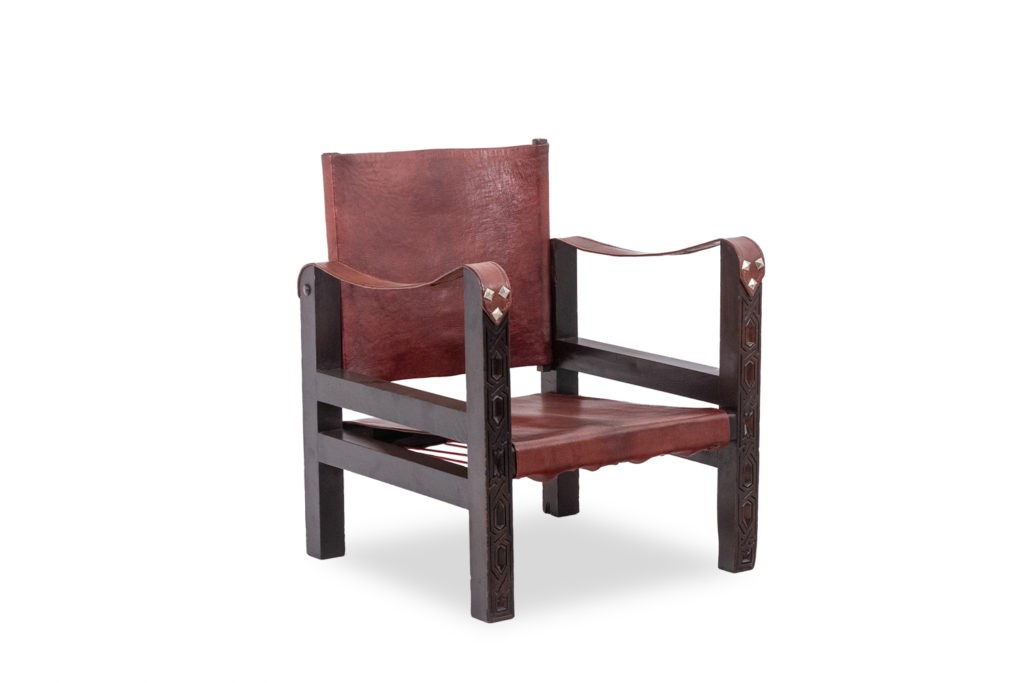 Fauteuil « Safari » en bois et cuir cognac. Années 1960/70.